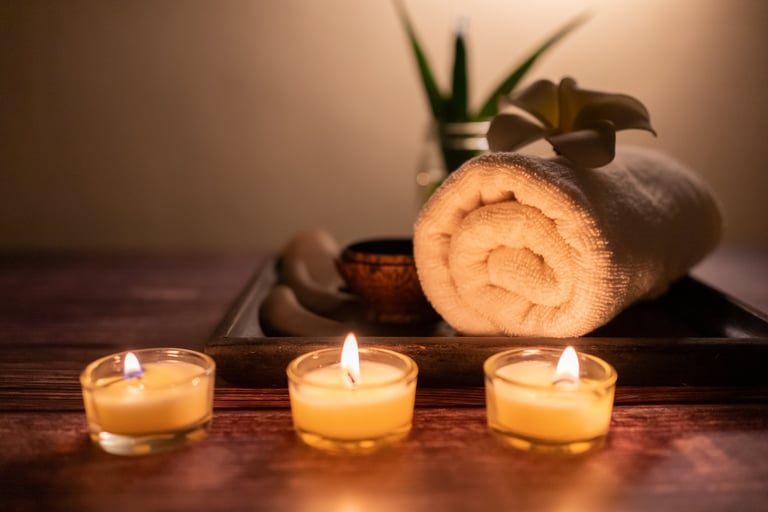 Grounded mood - wooden spa set with stones and candle on wooden background